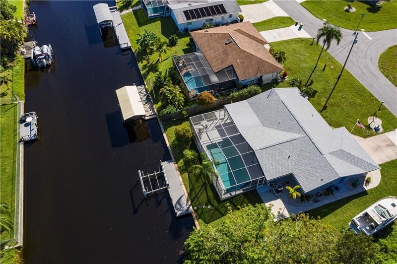 Aerial of home, pool and wide saltwater canal!