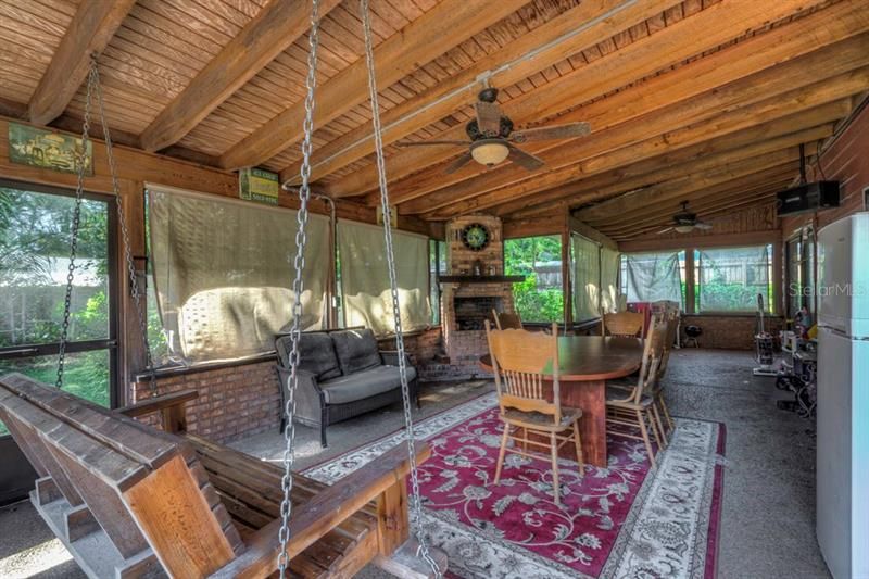 Screened in porch with swing.