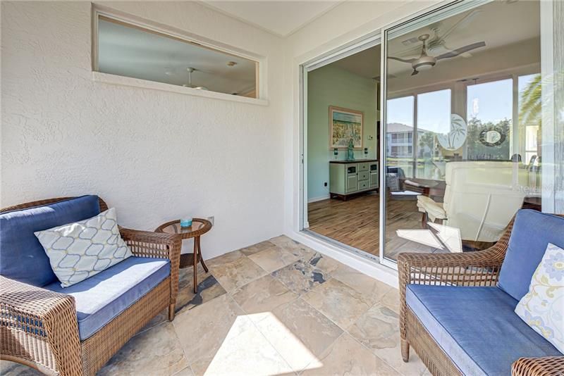 Perfectly sized lanai had ceramic tiles and sliders which easily lead to the living room.