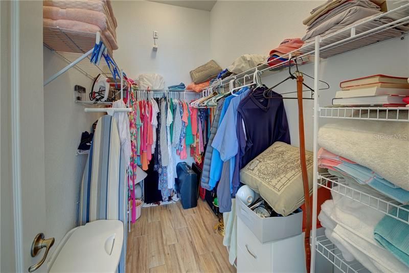 Master bedroom's large walk in closet meets all of your storage needs.