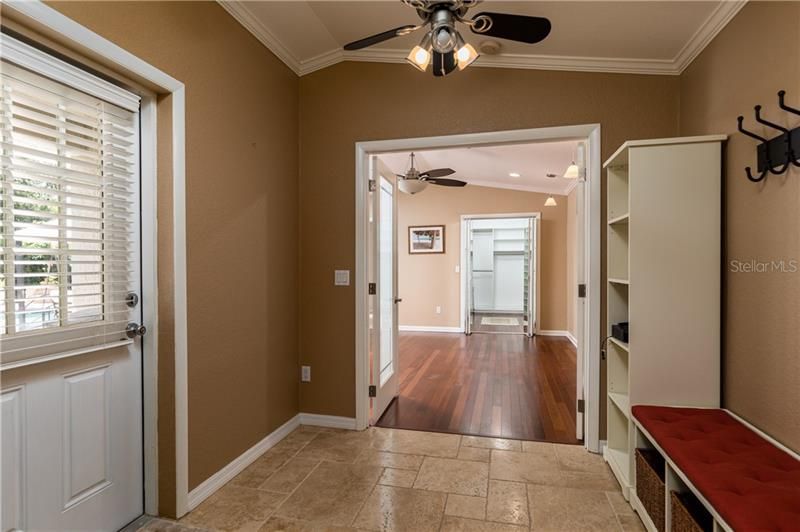 This area between the kitchen and the master bedroom (ensuite) opens to the patio and pool.