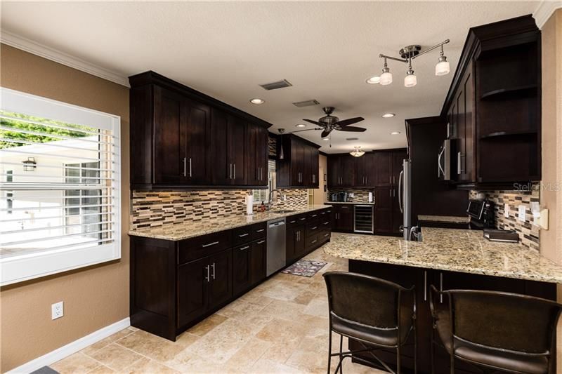 Kitchen, also, has coffee bar and wine refrigerator (and more cabinets, too.