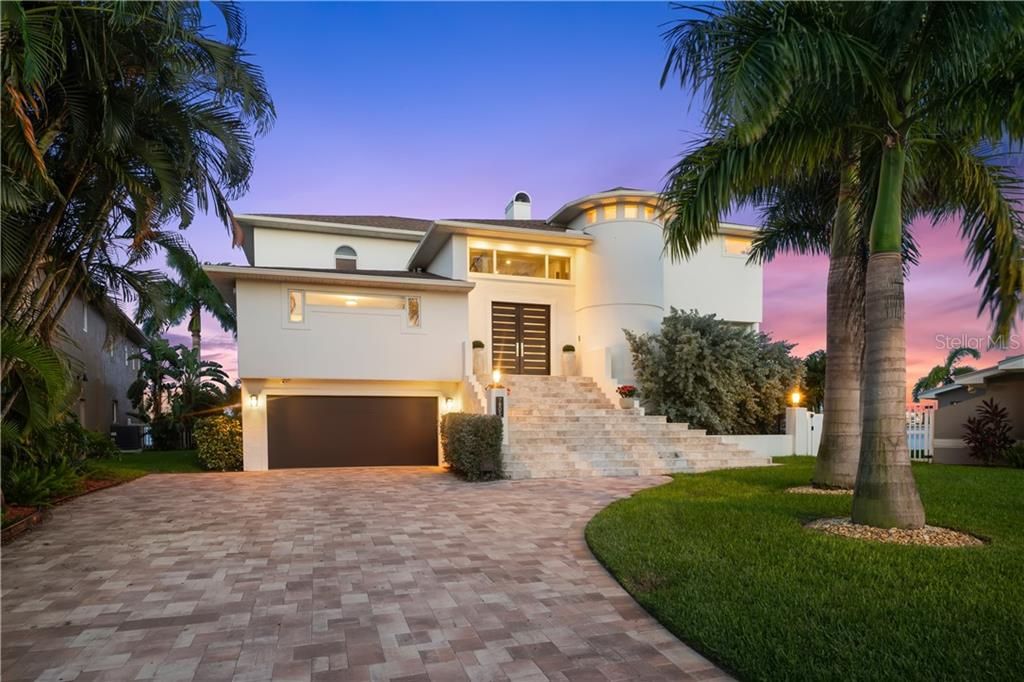 Gorgeous coastal contemporary home in Yacht Club Estates with open views and 137ft of waterfront!