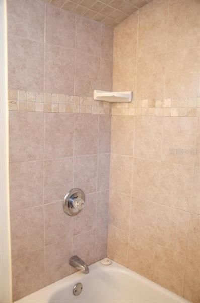 Shower has curved ceiling adding more character to this already adorable property!