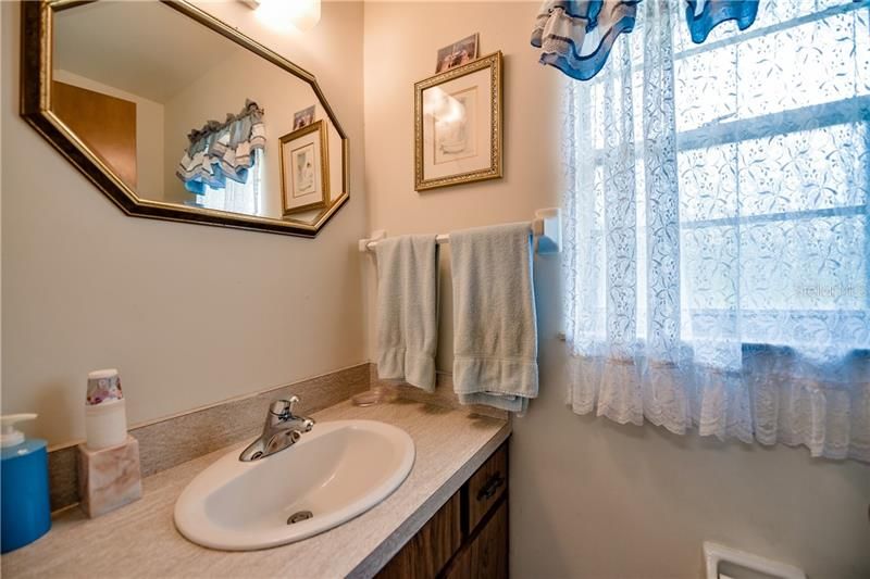 Half bath located in mudroom for easy clean up