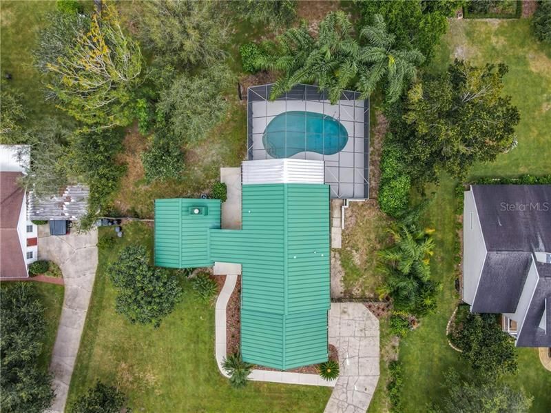 Aerial view of the home and pool