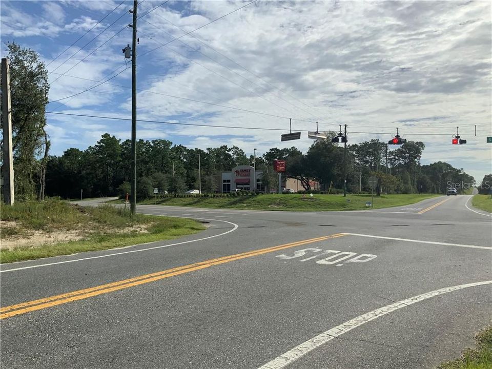 Convenient store is down the road from community