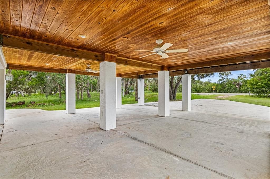 Wood Plank Ceiling Carport. Home Also Has 2 Car Garage.