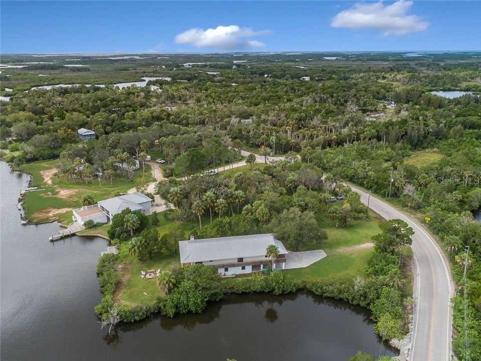 Surrounded By Water On Two Sides Of The Home. Gorgeous Views From Wrap Around Porch.