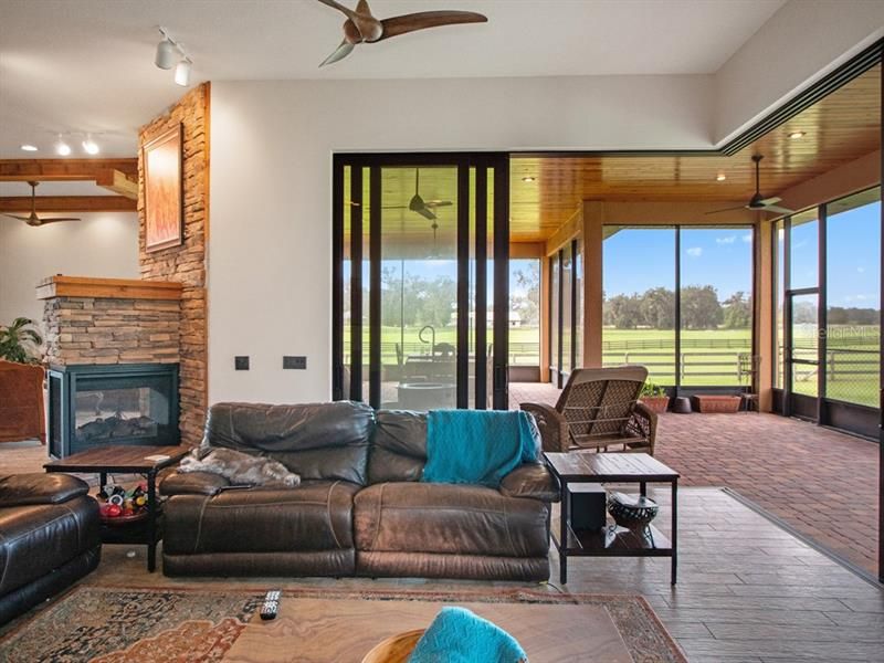 Family room with view of screen room & paddocks.
