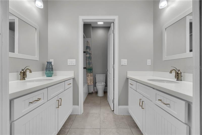 Guest-wing Bathroom w/ separate vanities & tub