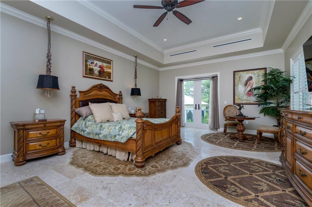 Master bedroom has private veranda over looking the pool house
