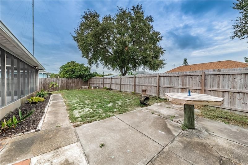 Patio with large fenced back yard