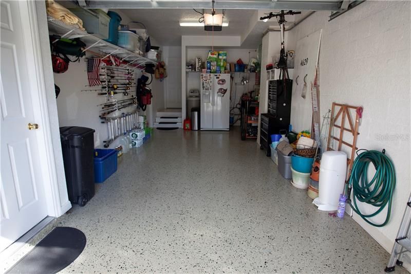 Garage with terrazzo floors, water filter and softener and generator that stays!
