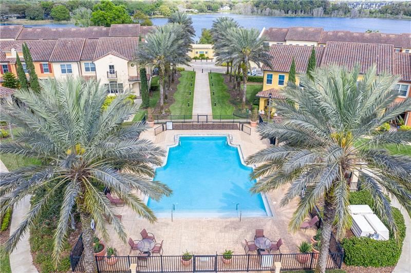Palm trees set the tone for the resort style pool. Vacation at home.