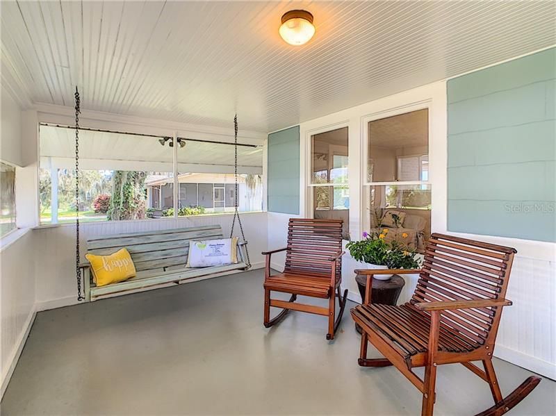 Sit back and relax on the front screened porch.