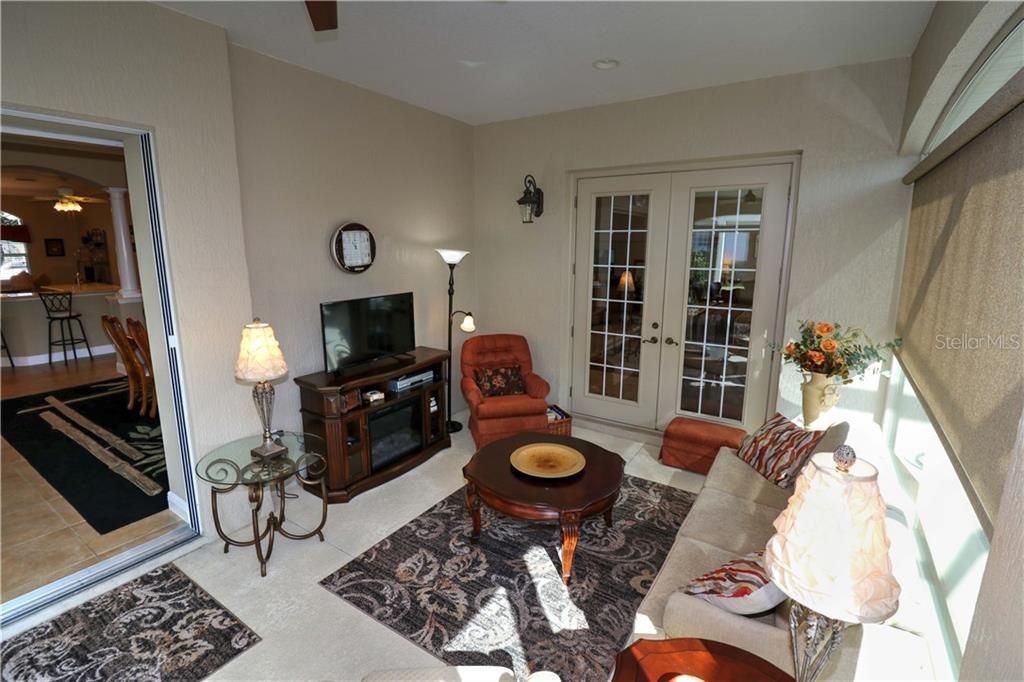 ELECTRIC FIREPLACE, SITTING AREA IN LANAI