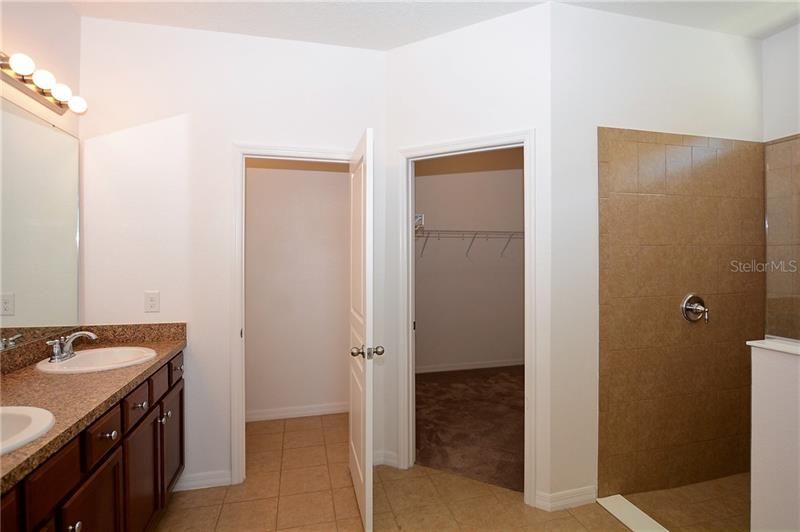 Owners Bathroom with Water Closet, Walk-in Closet and Shower