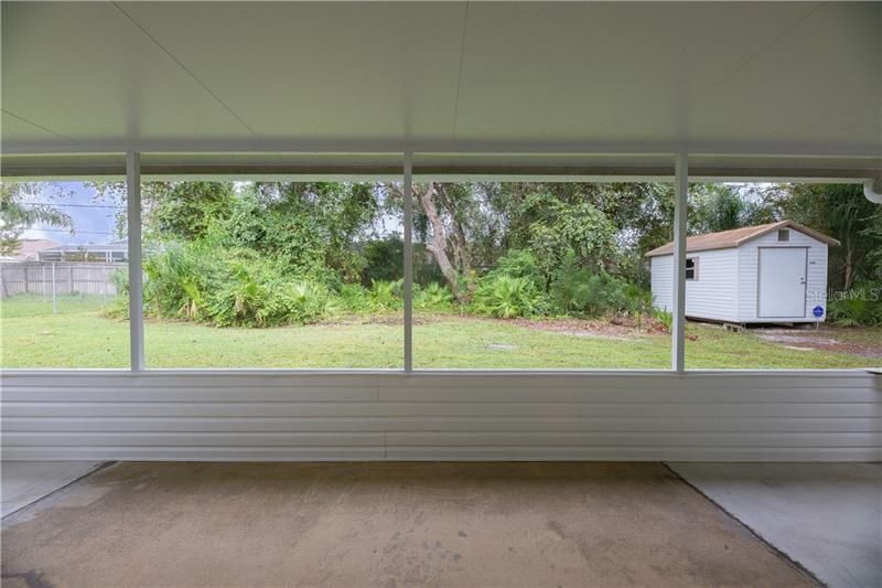 Sliding glass doors leading in to your new screened in lanai.