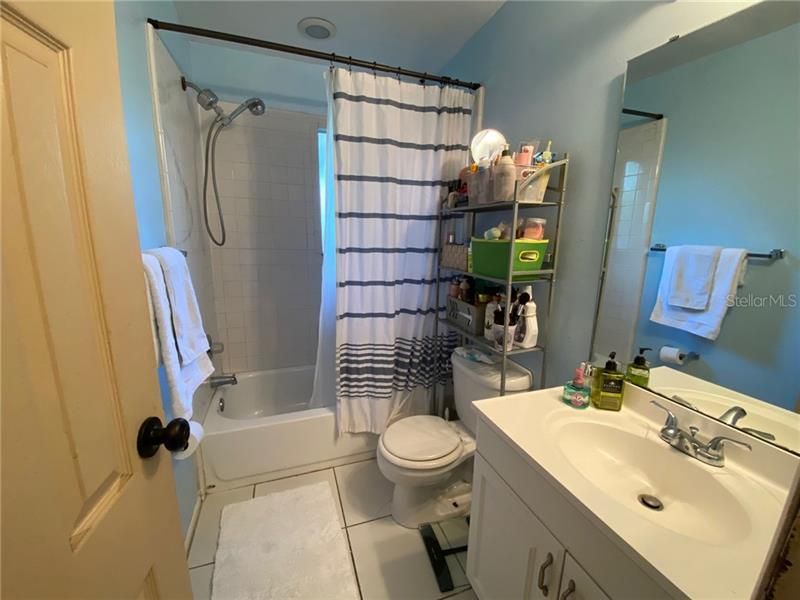 Hall bath has tub shower combo