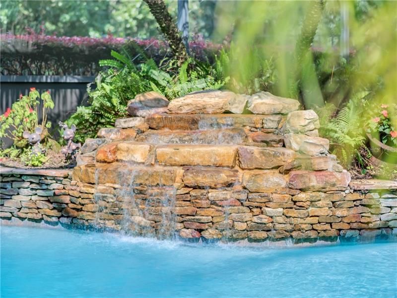 ENJOY THE RELAXING SOUNDS OF THE ROCK WATERFALL WHILE YOU RELAX ON YOUR COVERED LANAI