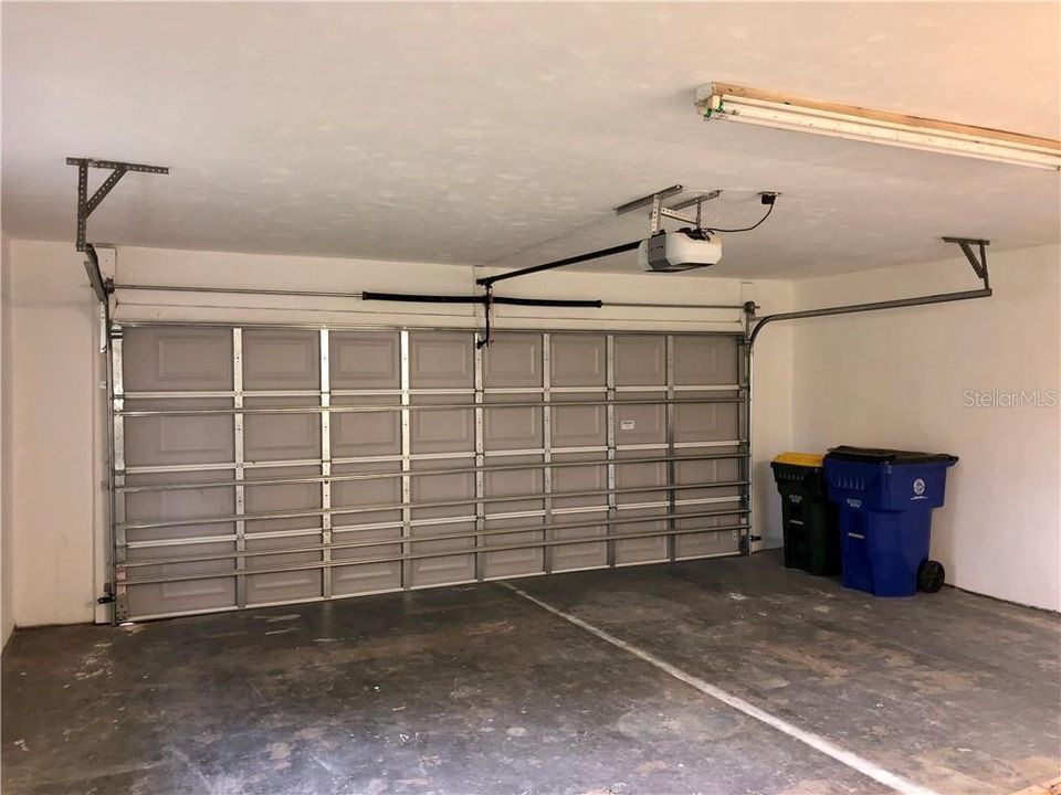 OVERSIZED DOUBLE CAR GARAGE WITH AUTOMATIC GARAGE DOOR OPENER