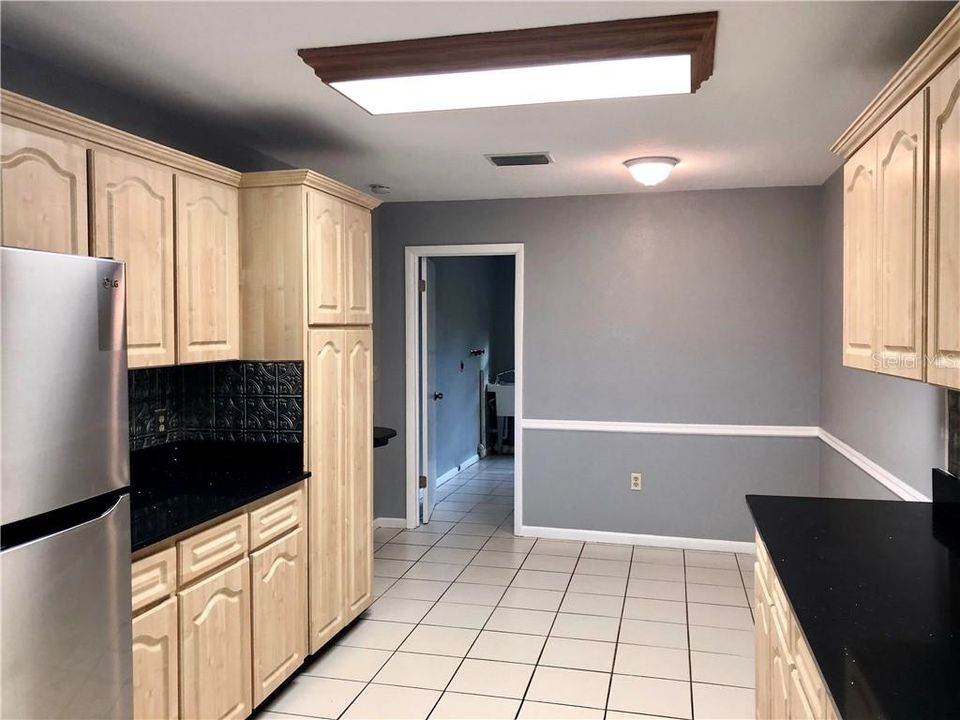 KITCHEN WITH EAT IN KITCHEN AREA AND ACCESS TO LAUNDRY ROOM