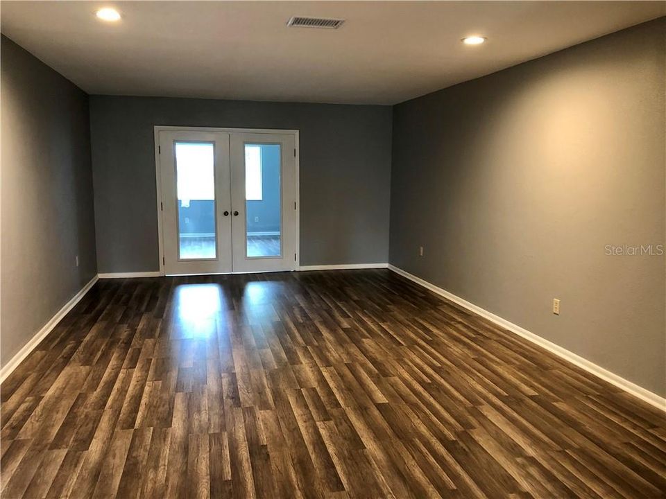 ENJOY YOUR LARGE LIVING ROOM RIGHT OFF THE 4TH BEDROOM (BEHIND THE FRENCH DOORS) OR USE THIS AS YOUR OFFICE/DEN/STUDY/NURSERY IT HAS A CLOSET SO IT CAN BE USED FOR WHATEVER YOU WANT AND THERE IS A FABULOUS VIEW OF THE GOLF COURSE.