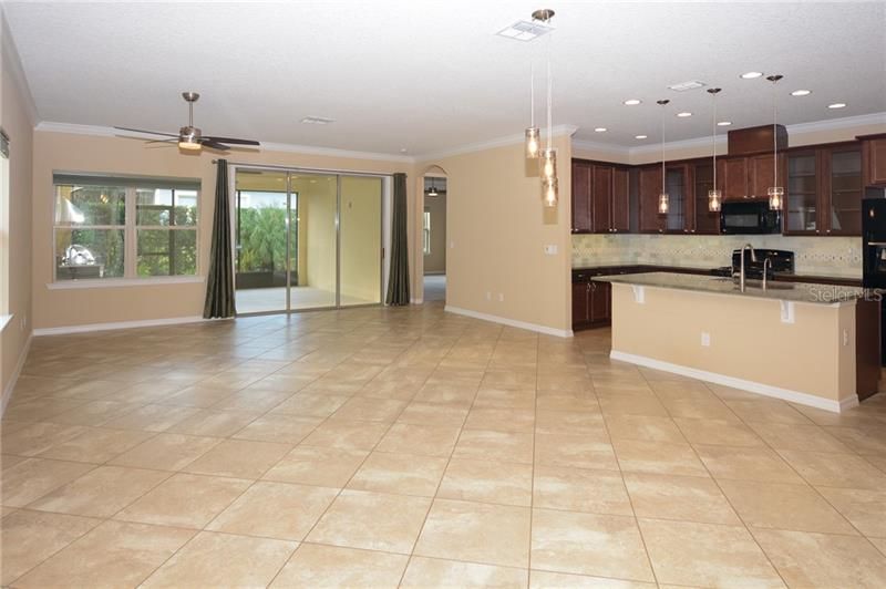 Family Room, Dining Room, Kitchen and Extended Lanai with Outdoor Kitchen. This is your view upon entry.