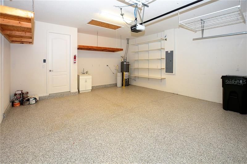 The Garage features Professionally Applied Epoxy Floor, Pull Down Attic Stairs, Sink, Whole House Water Filtration and Plenty of Storage