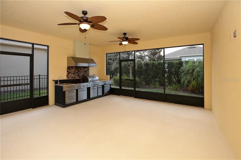 Screened Extended Lanai with Outdoor Kitchen and Pre-Wired for your Favorite Flat Panel TV