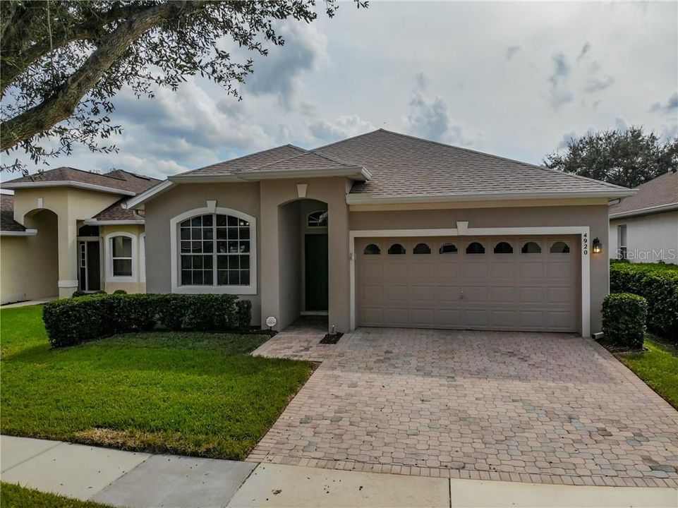 Front with paver driveway.  Home has a new roof 4/2019.