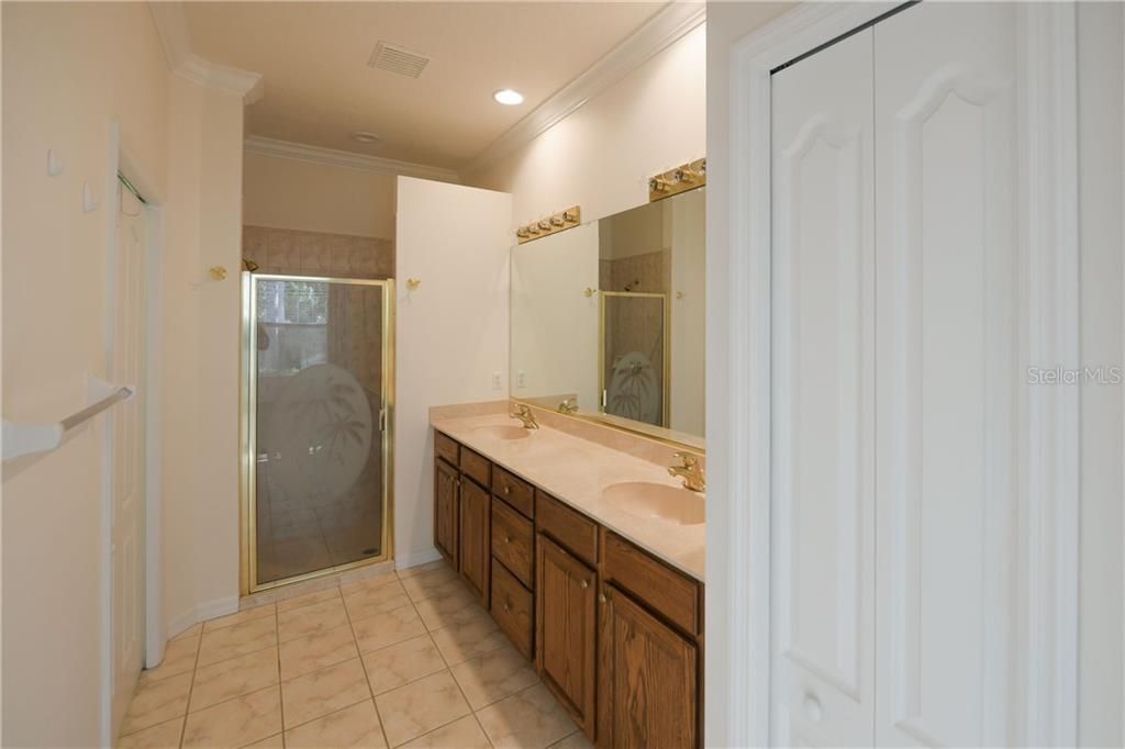 Master Bath with dual sinks and walk-in tile shower