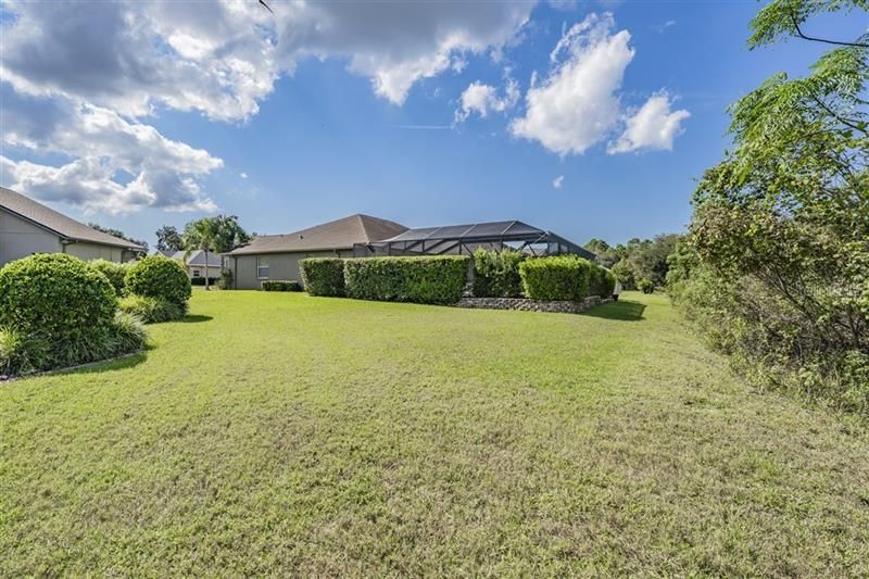 Exterior back shows additional landscaping providing privacy