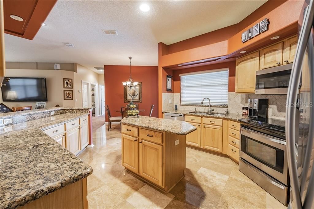 Kitchen island provides additional workspace and storage