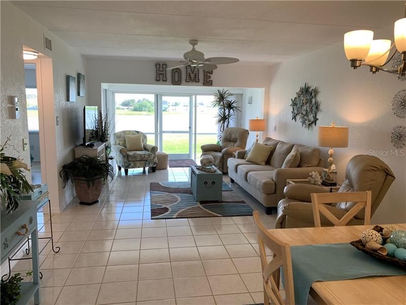 This great room truly is a GREAT room since it has been extended clear to the back of the unit rather than having a closed lanai.  This includes a dining area.  Furniture was purchased new in 2017 and comes with the unit.