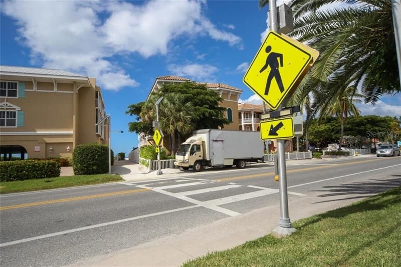 A convenient on demand cross walk with direct beach access, immediately across Gulf Drive, and you're on the powder white sands of The Gulf of Mexico.