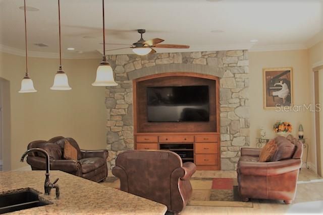 Living Room with Stone Entertainment Center