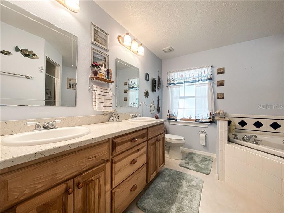 Master Bathroom with Dual Sinks and Vanities. Large Jetted Tub and Walk in Shower
