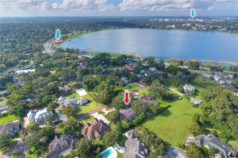 Located on a brick street very close to Lake Hollingsworth.  Lakeland Country Club in background marked with arrow and downtown Lakeland in the background.