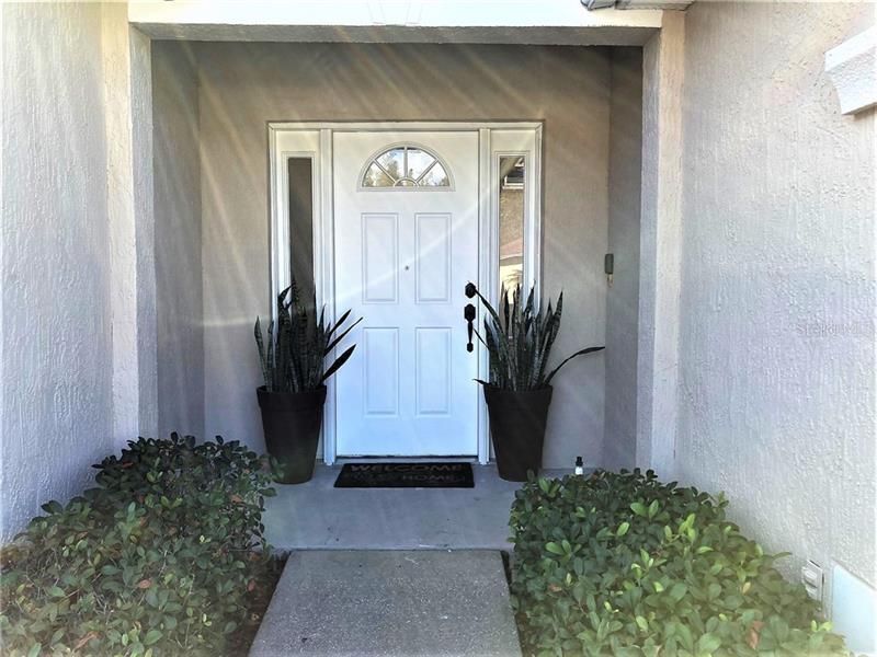 Front entry door opens into the courtyard