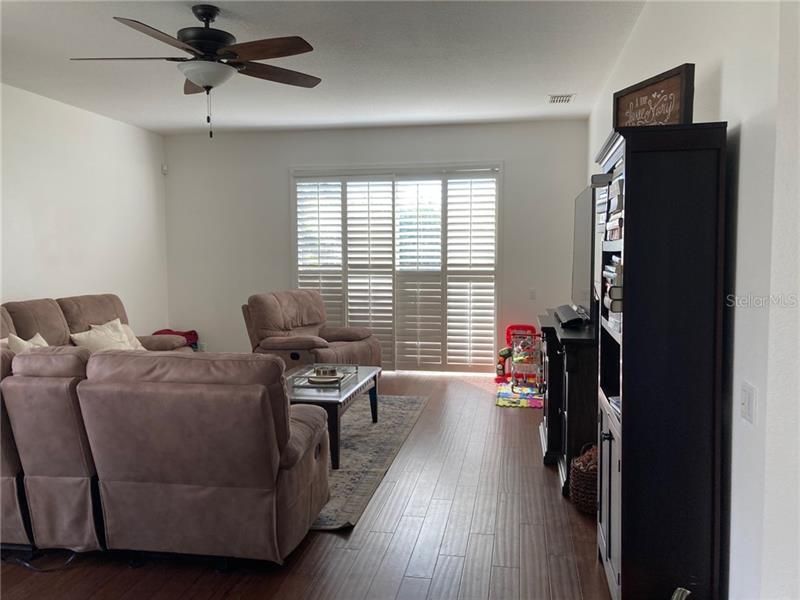 Spacious living room with bamboo floors.