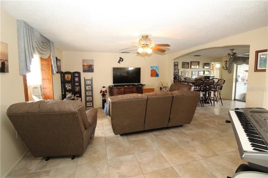 Living room to the left as you walk in front door.  Tile flooring throughout.