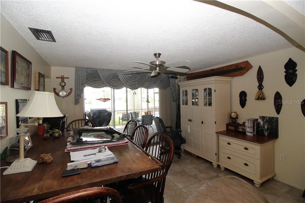 Formal Dining room off living room.  Pocket sliding glass door out into the screen/covered lanai.