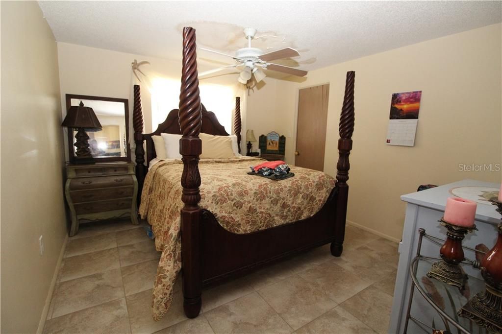 Bedroom #2.  Has walk-in closet.   Drywall on ceiling will be repaired after new roof is installed by seller.