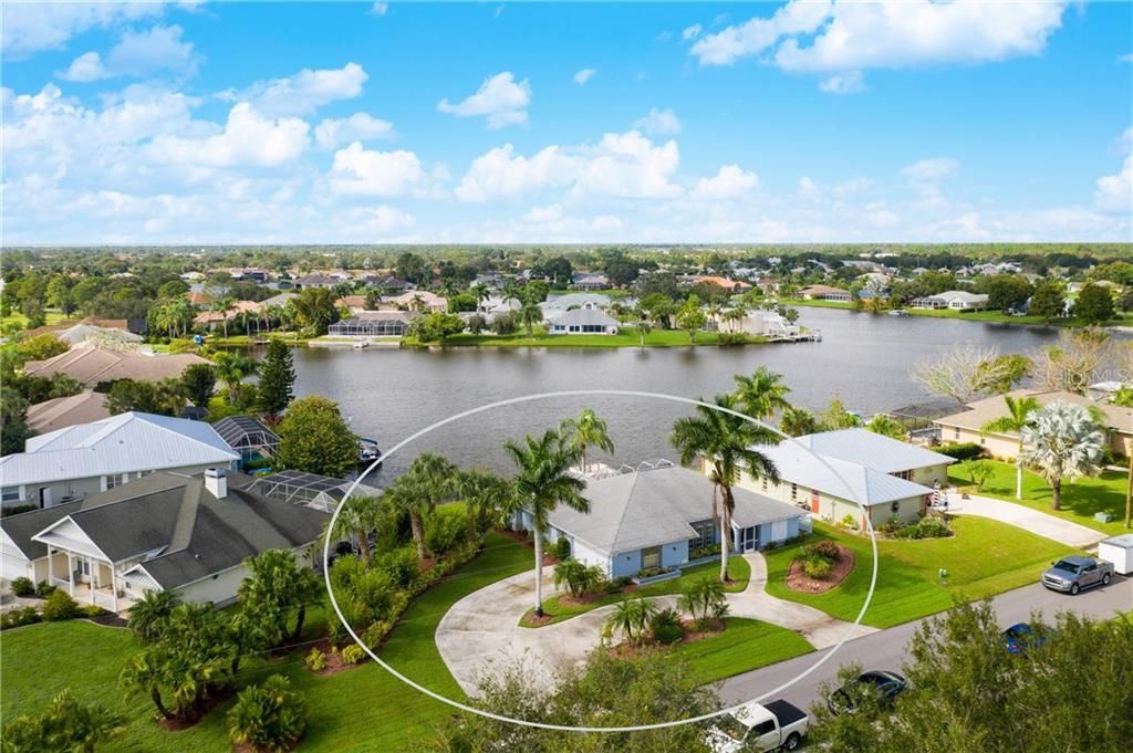 Huge circular driveway with lots of parking for family & friends at this lovely Lake Suzy Estates home