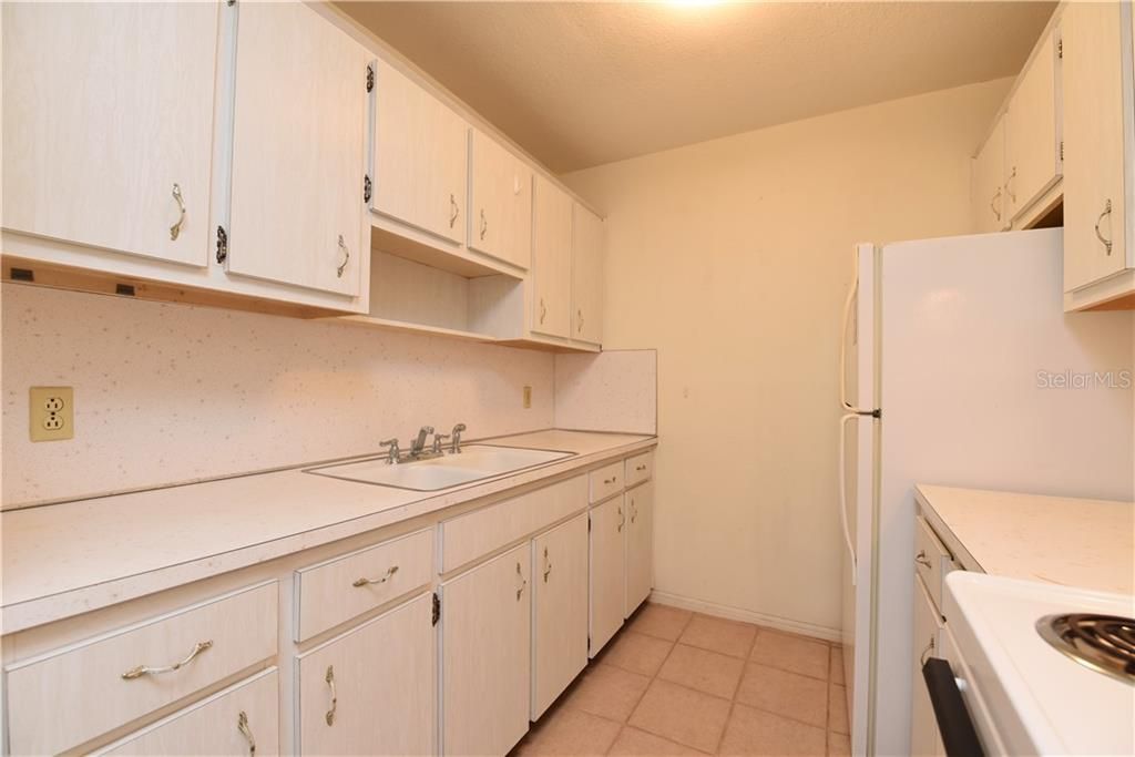 Kitchen with dishes and utensils.