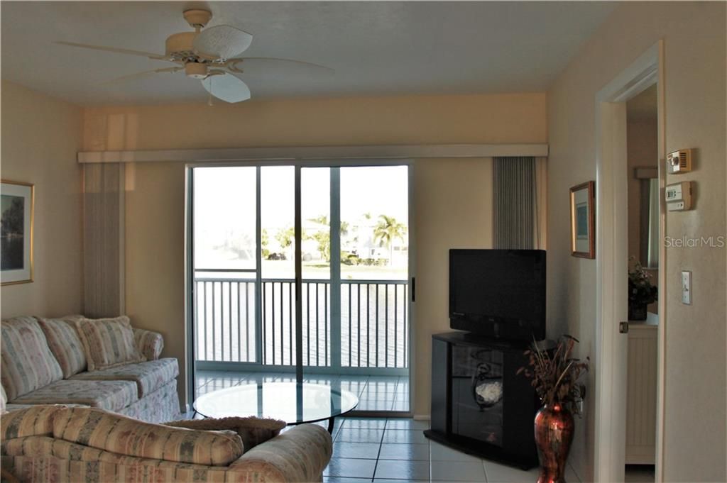 Living Room with sliding door entry to screened lanai