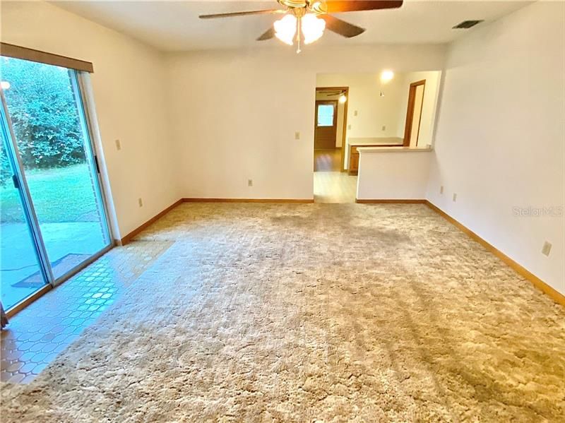 Family room off kitchen has sliding glass doors to yard