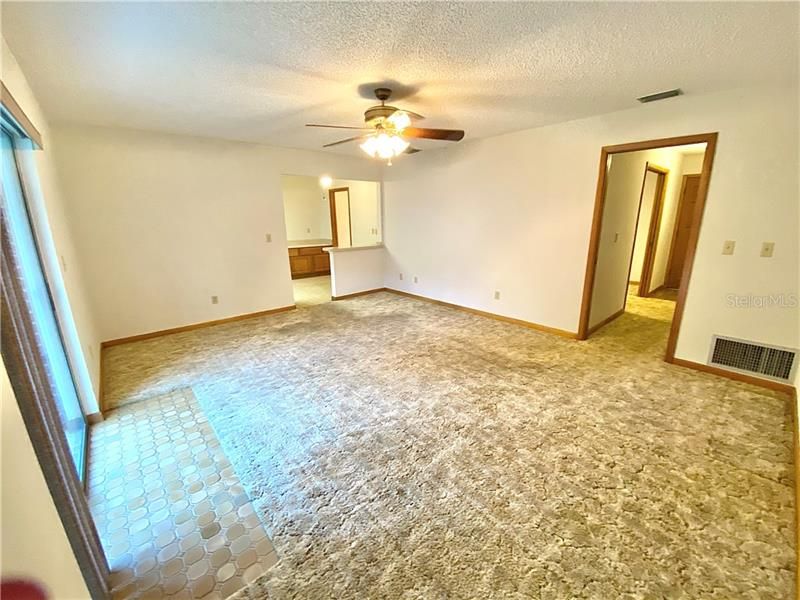 Family room off kitchen has sliding glass doors to yard